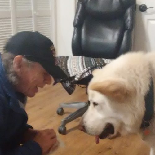 Leo interacts with a veteran; Mobile Veteran Outreach