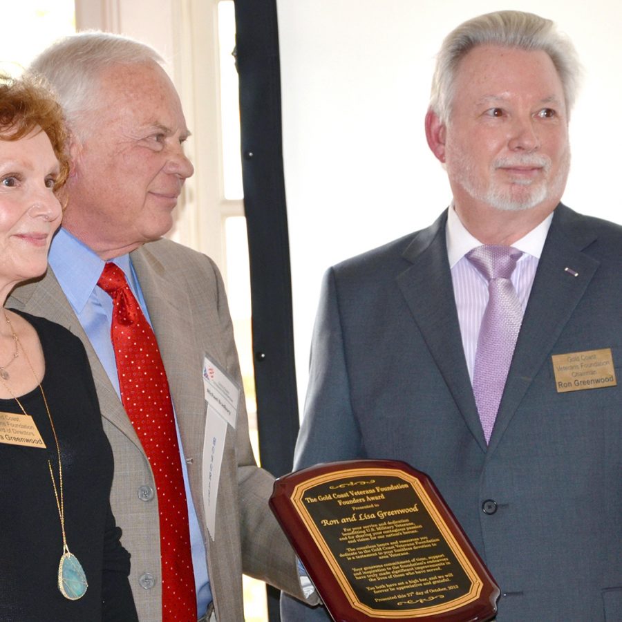 Ronald J. Greenwood and Lisa Elizabeth Greenwood receiving award