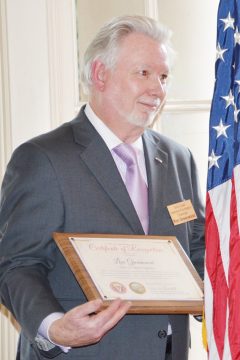 Ronald J. Greenwood with award